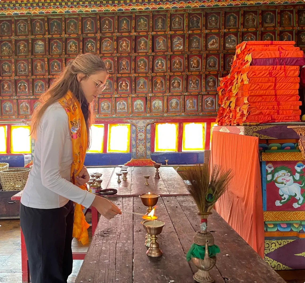 A tourist offers prayers to the shrine at Serang Monastery